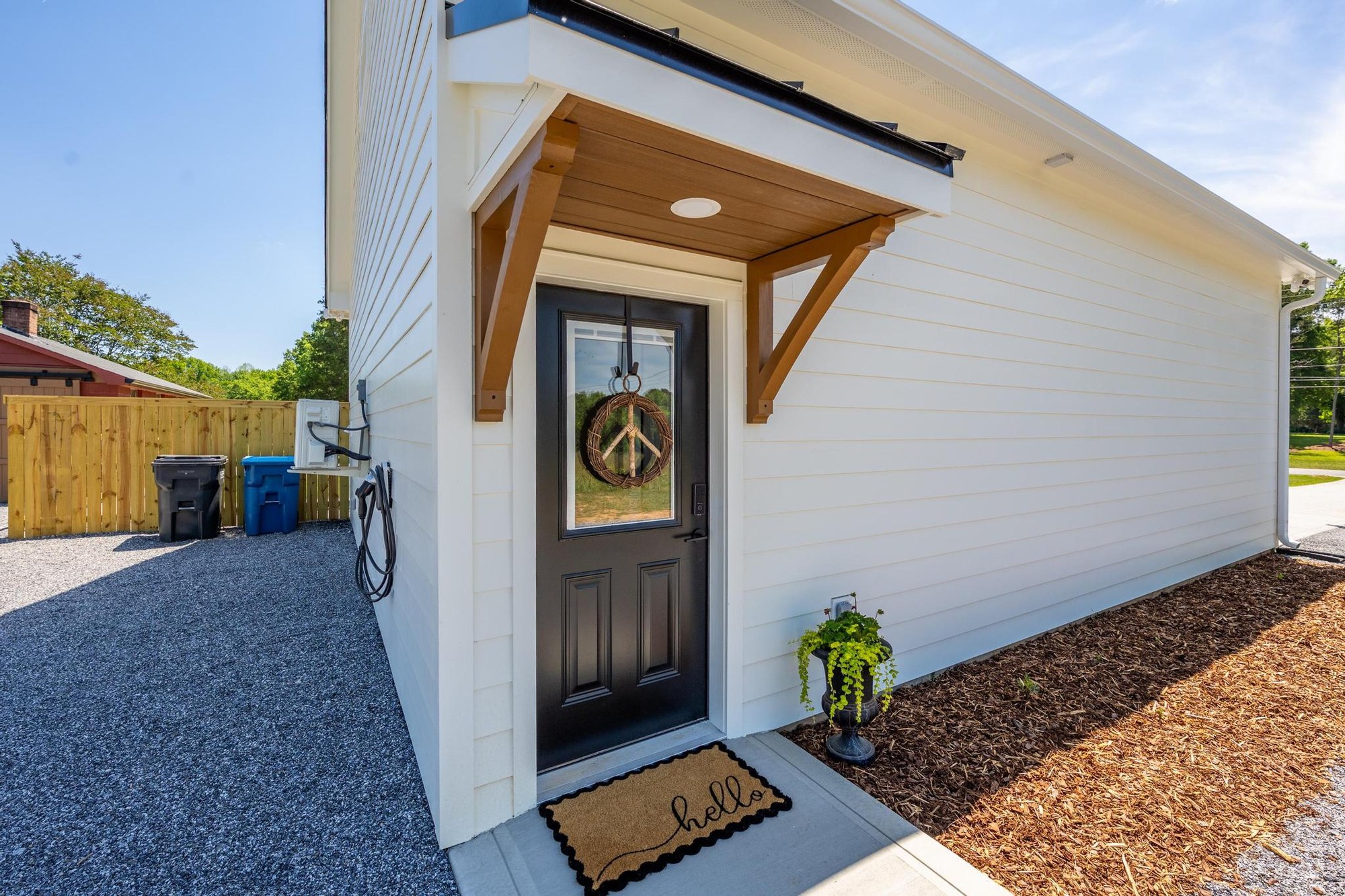 Private entrance, dedicated parking area and EV charger